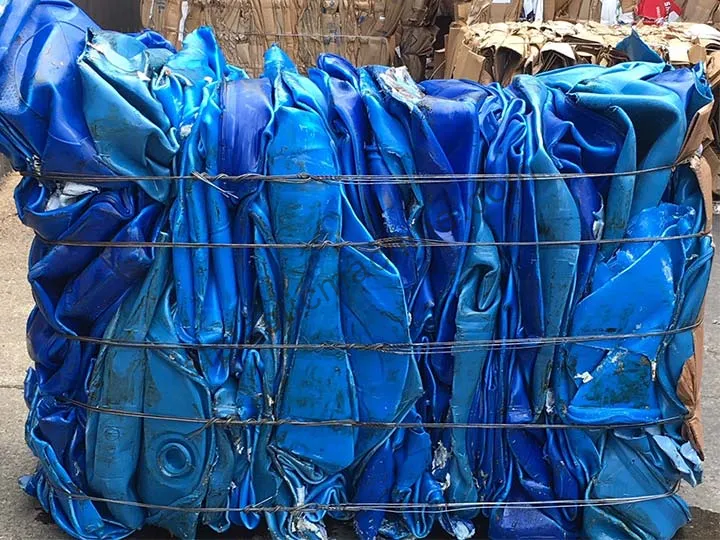 baled blue HDPE drums